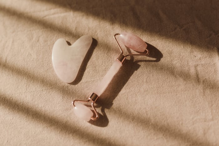 A Close-Up Shot of a Facial Roller and Guasha Facial Stone