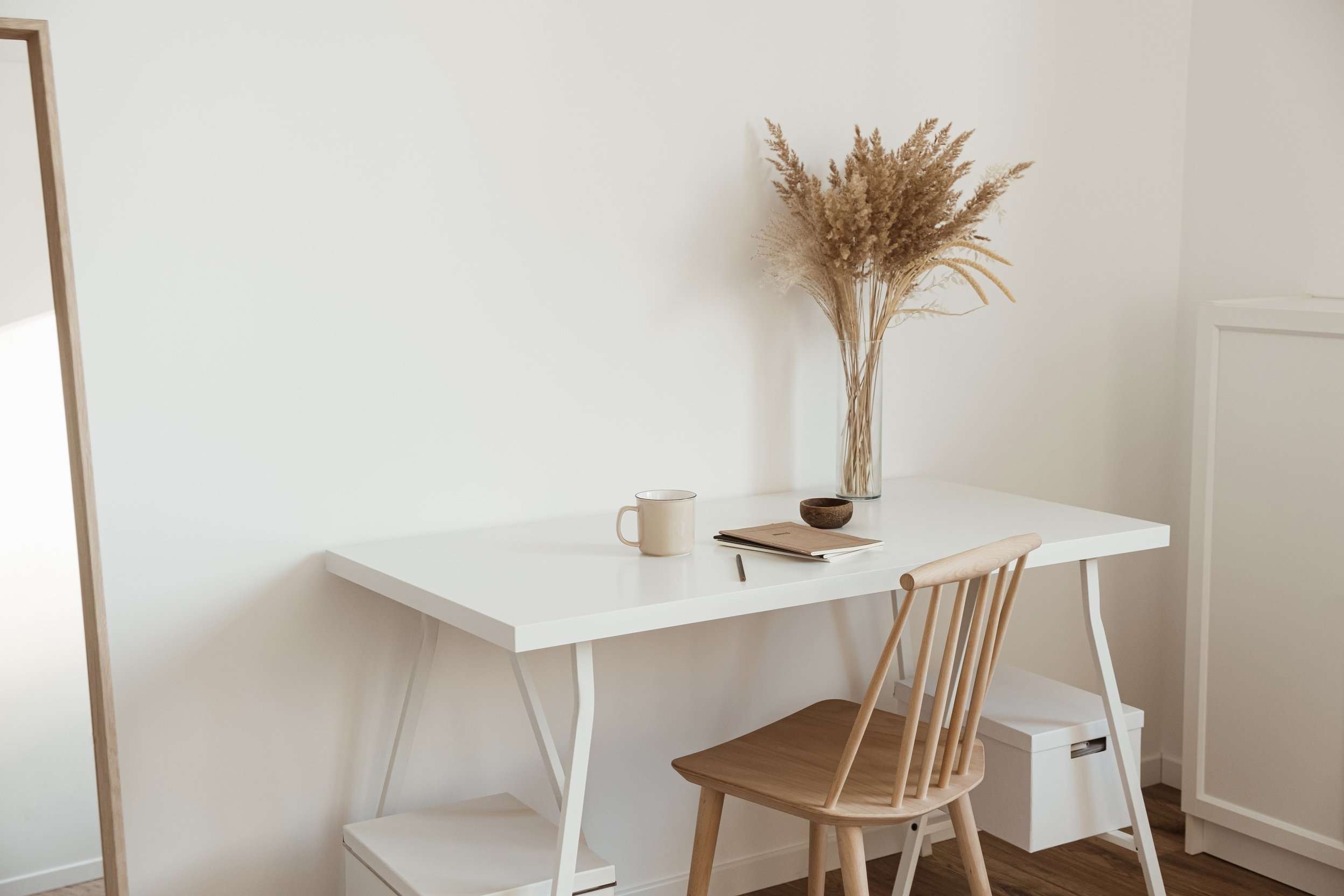 Minimalist Chair and Table with Cup, Notebook and Dried Flowers